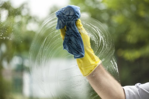 Cleaner following safe working practices during carpet cleaning